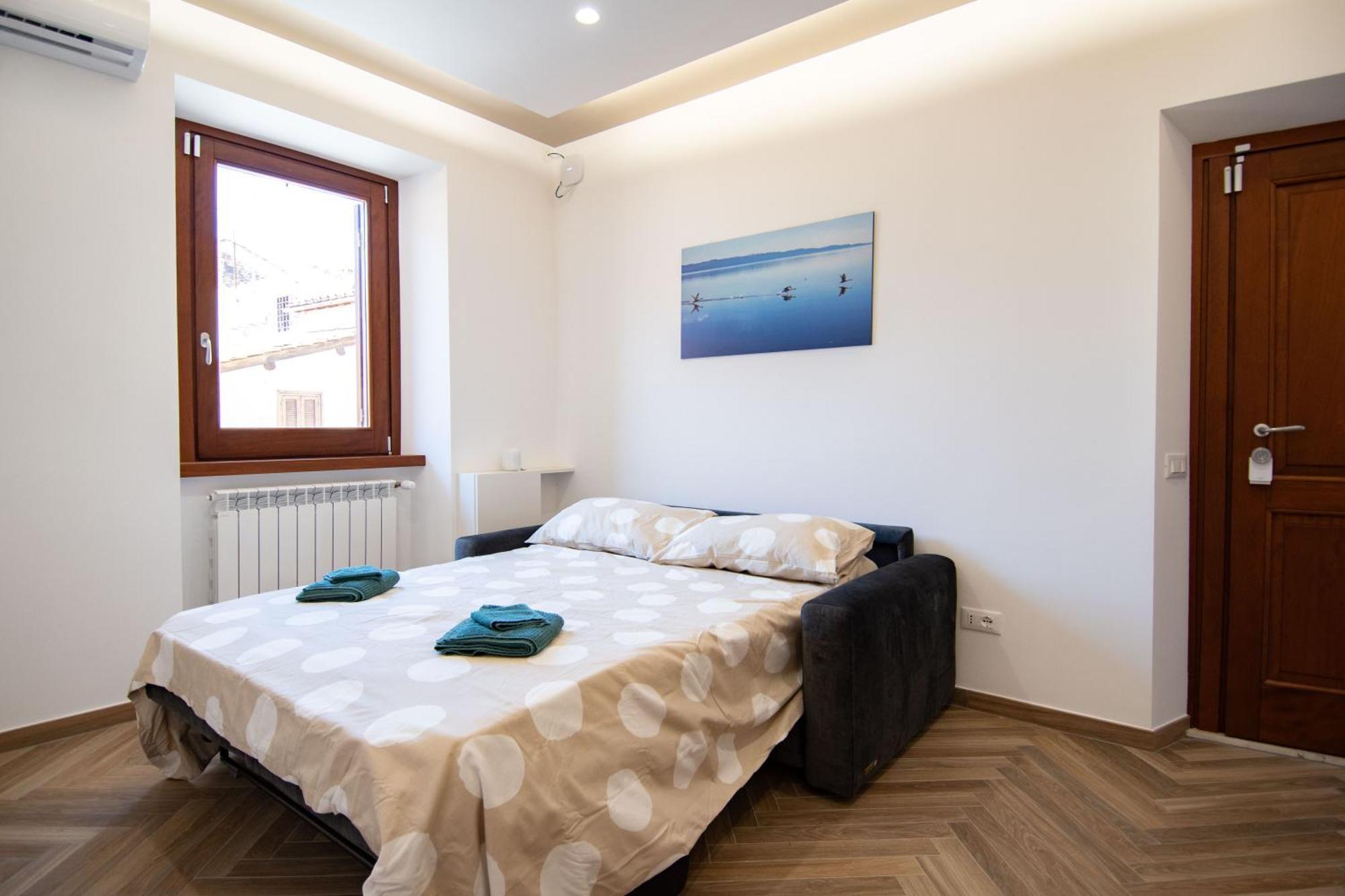 Finestra Sul Borgo Apartment Тревиняно Романо Екстериор снимка